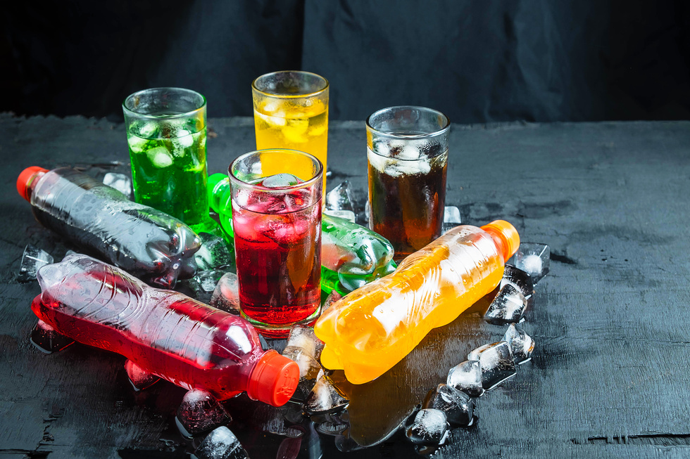 Glasses and Bottles of Soft Drinks